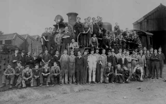 group of vulcanists (apprentices) with loco